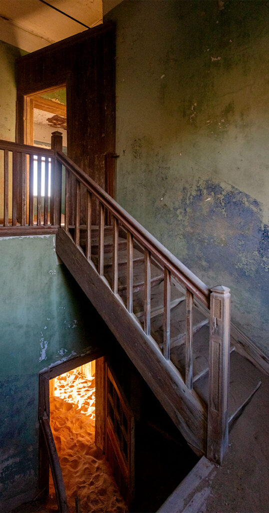 staircase showing two abandoned floors of a house